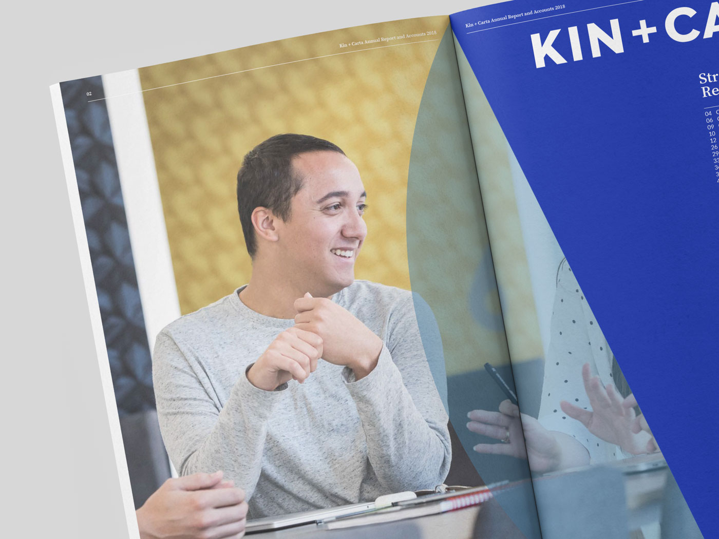 A page of an annual report showing an image of a man and the brand Kin + Carta
