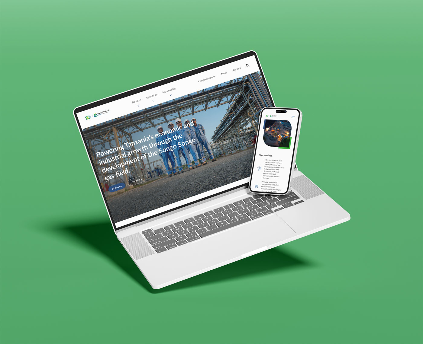 A laptop and mobile show pages from a website with images and graphics