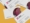 A pile of business cards laying on a table showing the Redx pharma brand and imagery
